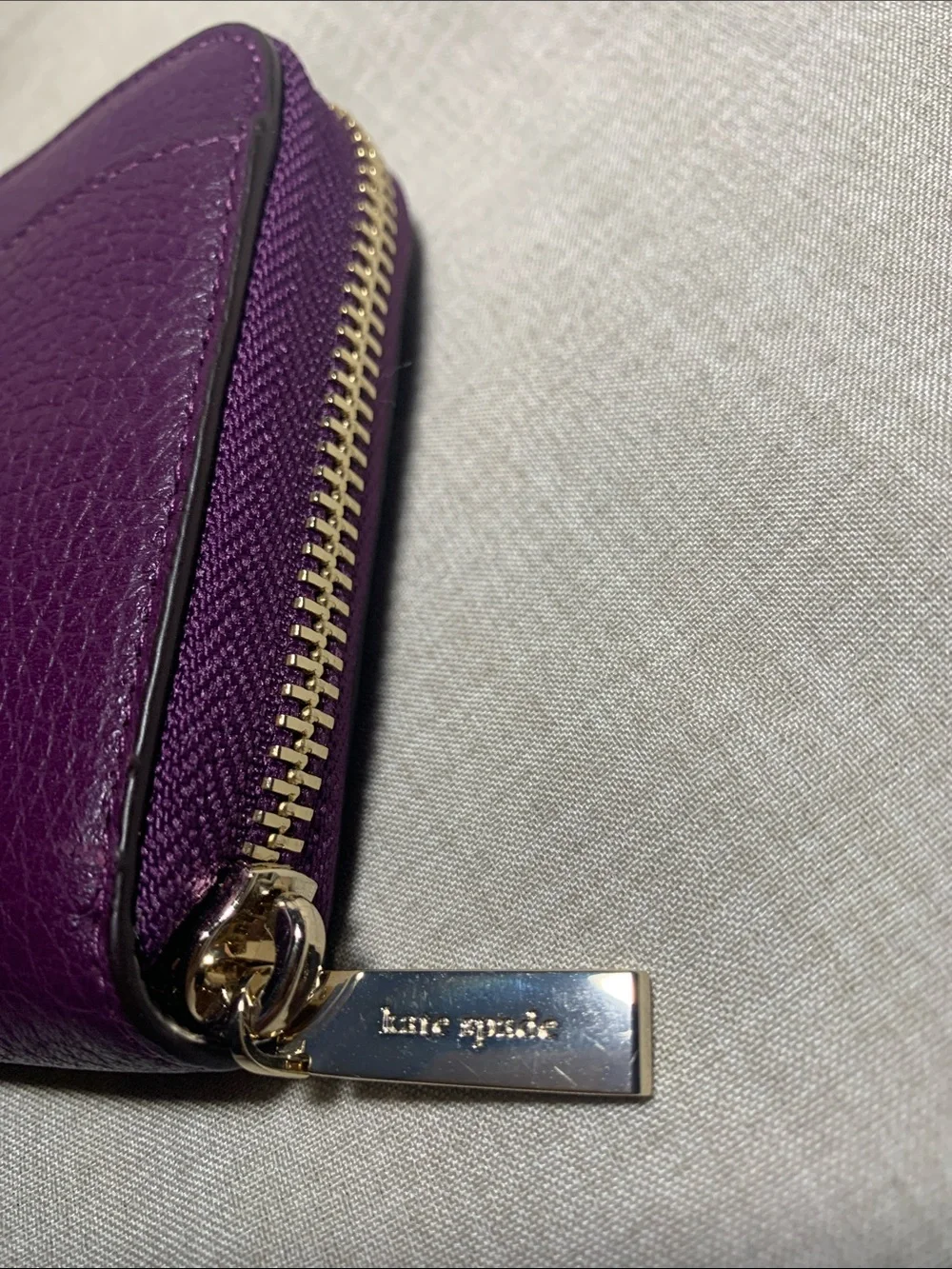 kate spade deep purple pebbled leather zip wallet